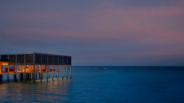 the ritz carlton maldives fari islands la locanda exterior night